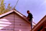 Sara painting the roof edge