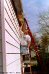 Jeff painting on a ladder